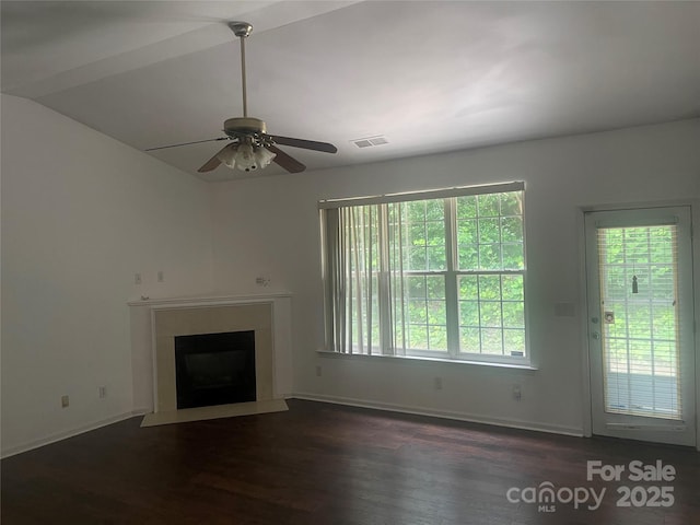 4454 Glenlea Commons Dr, Charlotte, NC 28216 - unfurnished living room with dark wood-style flooring, healthy amount of natural light, a ceiling fan, a fireplace with flush hearth, and vaulted ceiling