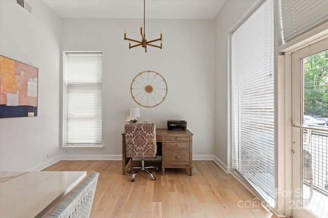 1315 E Blvd Unit 225, Charlotte, NC 28203 - office space featuring light wood finished floors and a chandelier