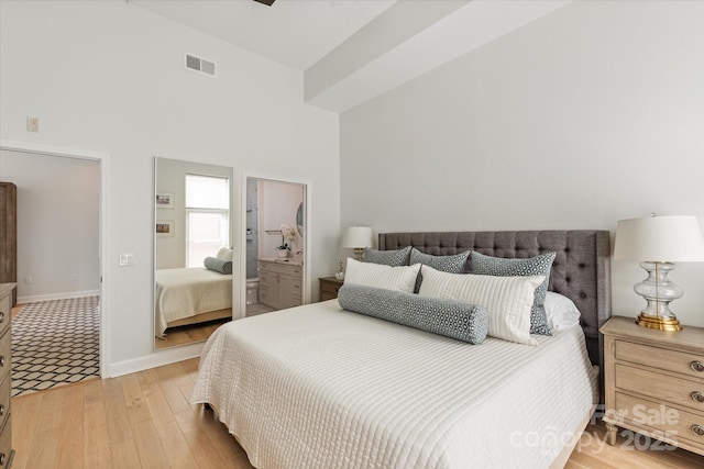 1315 E Blvd Unit 225, Charlotte, NC 28203 - bedroom featuring light wood-style floors and a high ceiling