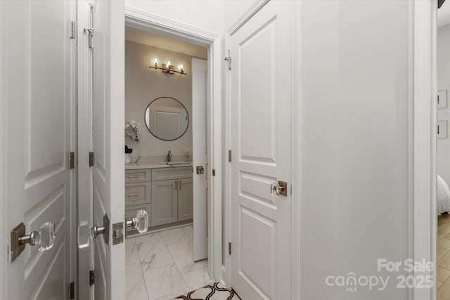 1315 E Blvd Unit 225, Charlotte, NC 28203 - bathroom with vanity and marble finish floors