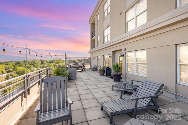 1315 E Blvd Unit 225, Charlotte, NC 28203 - patio terrace at dusk featuring a balcony