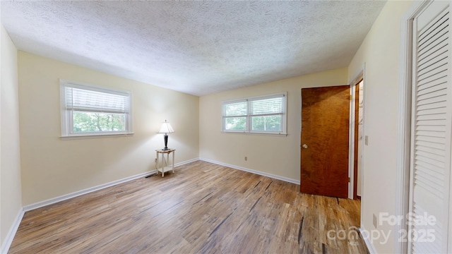 212 Fallen Timber Rd Unit 23, Hendersonville, NC 28791 - unfurnished room featuring wood finished floors and a textured ceiling