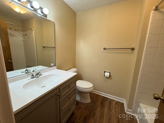 212 Fallen Timber Rd Unit 23, Hendersonville, NC 28791 - full bath with wood finished floors, vanity, shower / tub combination, and a textured ceiling