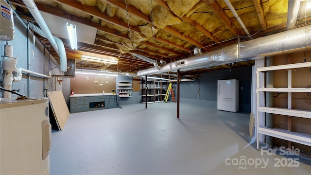 212 Fallen Timber Rd Unit 23, Hendersonville, NC 28791 - unfinished basement with freestanding refrigerator and water heater
