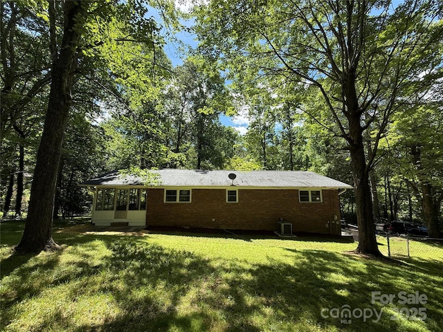 212 Fallen Timber Rd Unit 23, Hendersonville, NC 28791 - back of property with a sunroom and brick siding
