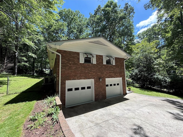 212 Fallen Timber Rd Unit 23, Hendersonville, NC 28791 - view of property exterior with driveway, brick siding, and view of scattered trees