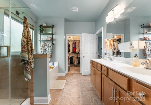 163 Sassafras Rd, Mooresville, NC 28115 - full bath with a stall shower, a garden tub, double vanity, and a walk in closet