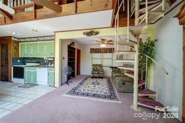177 Mountain View Ln, Troy, NC 27371 - kitchen with white appliances, ceiling fan, tasteful backsplash, green cabinets, and light carpet