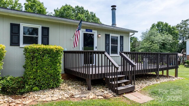 1467 Conway Dr, Granite Falls, NC 28630 - property entrance with a wooden deck and a lawn