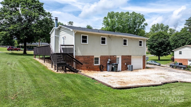 1467 Conway Dr, Granite Falls, NC 28630 - back of property with a garage, stairway, brick siding, gravel driveway, and a yard
