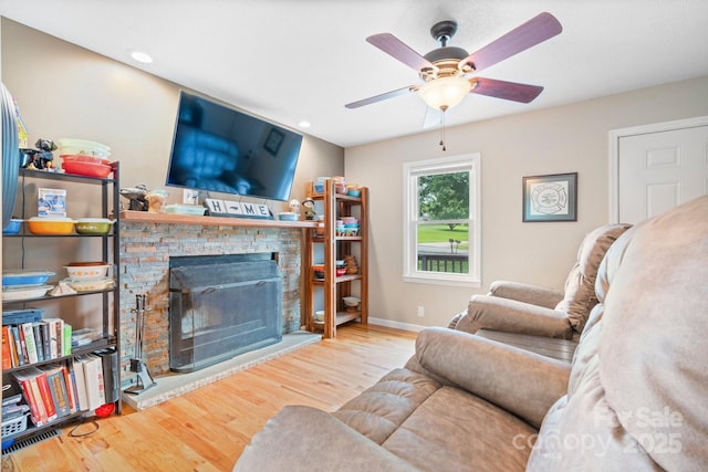 1467 Conway Dr, Granite Falls, NC 28630 - living area with a stone fireplace, wood finished floors, a ceiling fan, and recessed lighting