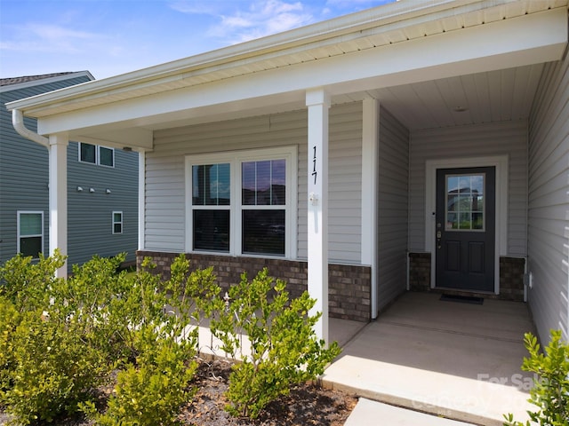 117 Carmine Ct, Troutman, NC 28166 - property entrance with stone siding and covered porch