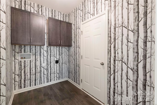 117 Carmine Ct, Troutman, NC 28166 - washroom featuring cabinet space, wallpapered walls, washer hookup, and dark wood-type flooring