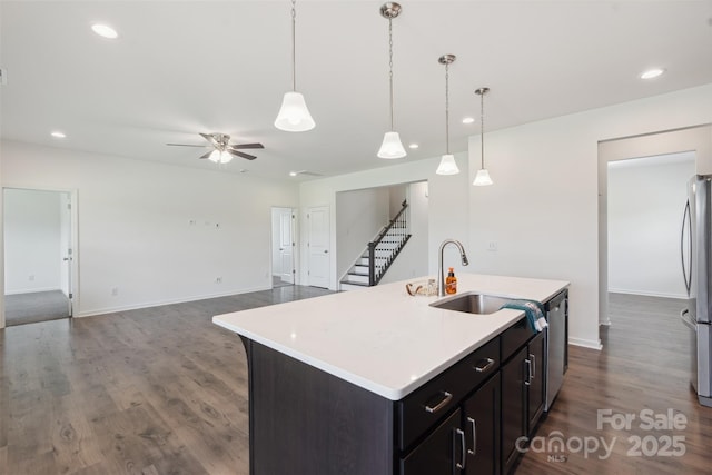 117 Carmine Ct, Troutman, NC 28166 - kitchen featuring light countertops, ceiling fan, dark wood-style flooring, stainless steel appliances, and recessed lighting