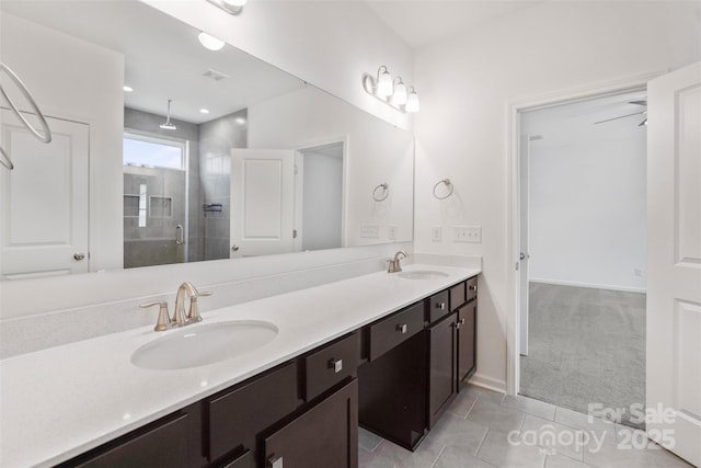 117 Carmine Ct, Troutman, NC 28166 - bathroom featuring a shower stall, double vanity, and tile patterned floors