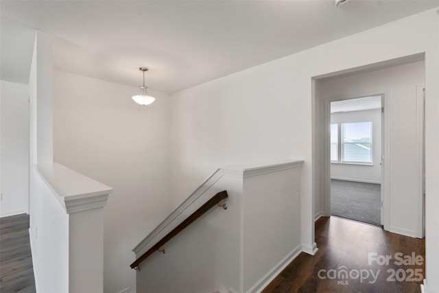 117 Carmine Ct, Troutman, NC 28166 - stairs featuring wood finished floors and baseboards