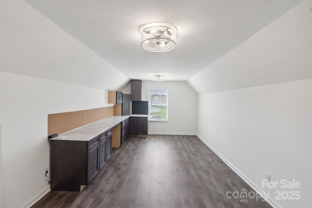 117 Carmine Ct, Troutman, NC 28166 - bonus room with dark wood-style floors and lofted ceiling