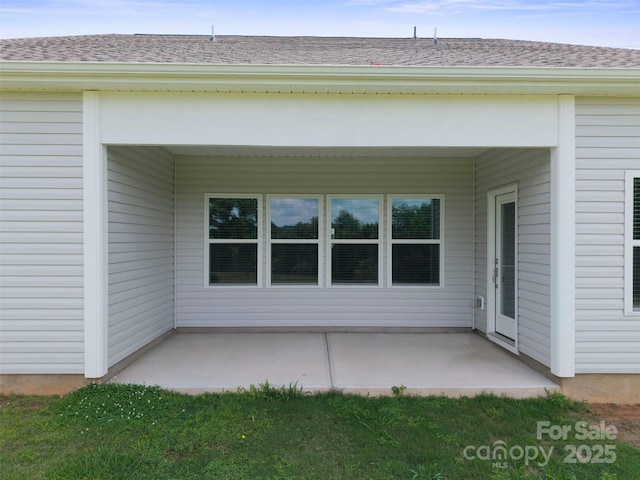 117 Carmine Ct, Troutman, NC 28166 - rear view of property with a patio area and roof with shingles
