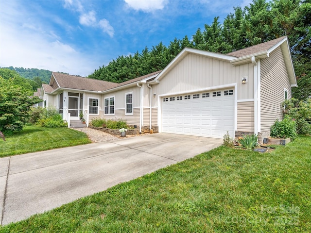 9 Farthings Dr, Arden, NC 28704 - ranch-style home with an attached garage, driveway, a front yard, and board and batten siding