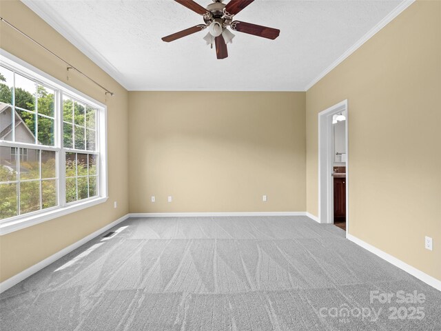 9 Farthings Dr, Arden, NC 28704 - carpeted spare room with a ceiling fan and crown molding