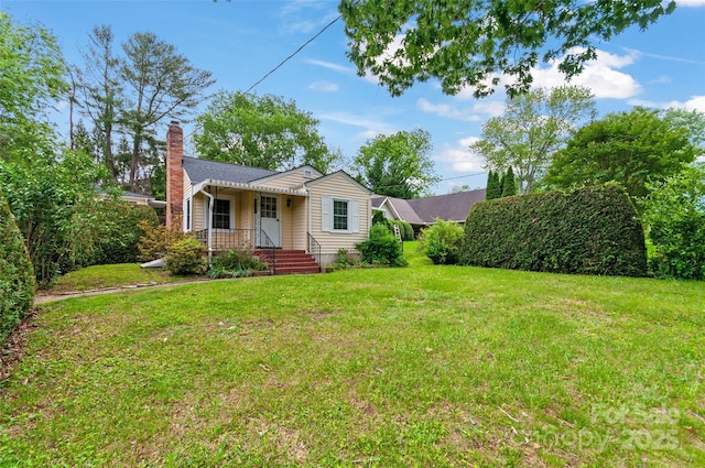 141 Elkwood Ave, Asheville, NC 28804 - view of front of property with a chimney and a front lawn