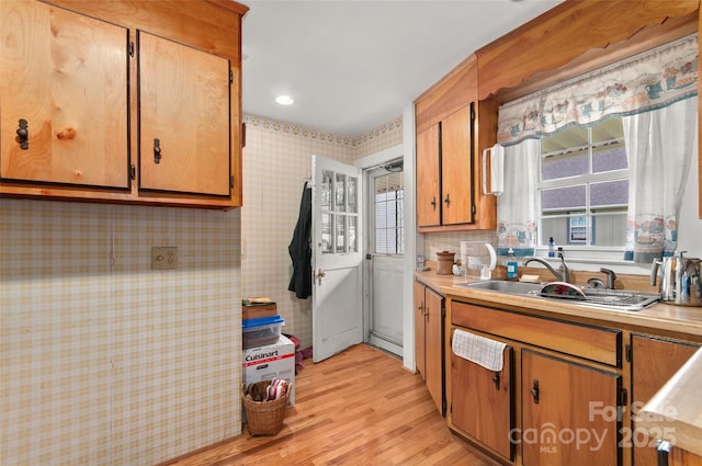 141 Elkwood Ave, Asheville, NC 28804 - kitchen featuring wallpapered walls, light wood-style flooring, healthy amount of natural light, and light countertops