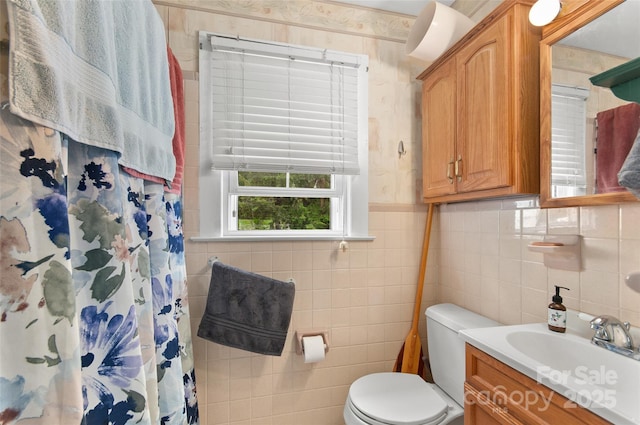 141 Elkwood Ave, Asheville, NC 28804 - bathroom featuring vanity, tile walls, wallpapered walls, and a shower with curtain