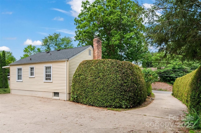 141 Elkwood Ave, Asheville, NC 28804 - view of side of property with a chimney and concrete driveway
