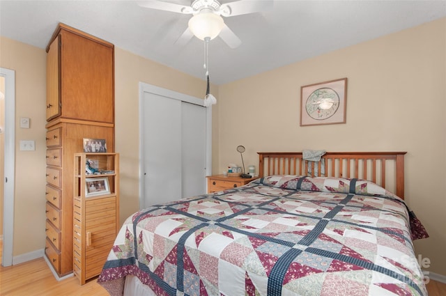 141 Elkwood Ave, Asheville, NC 28804 - bedroom with light wood-type flooring, a closet, and ceiling fan
