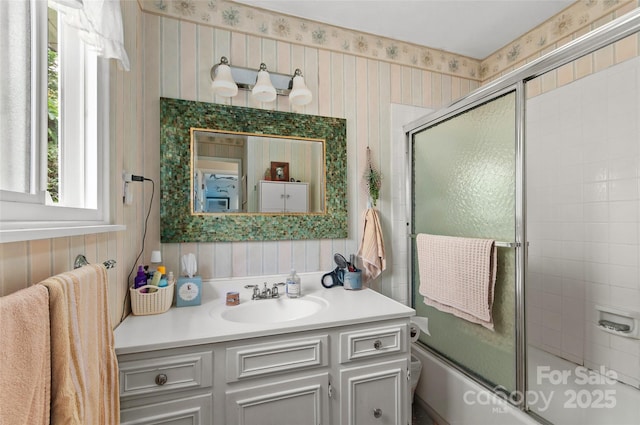 141 Elkwood Ave, Asheville, NC 28804 - full bath featuring vanity, wallpapered walls, and shower / bath combination with glass door