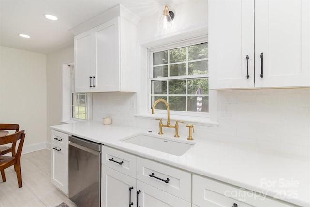 3969 Sheffield Dr, Charlotte, NC 28205 - kitchen with stainless steel dishwasher, tasteful backsplash, white cabinets, light countertops, and recessed lighting