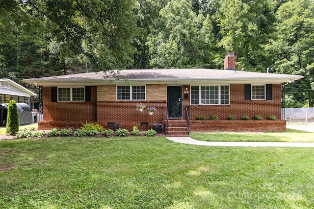 3969 Sheffield Dr, Charlotte, NC 28205 - view of front facade featuring a chimney, a front lawn, brick siding, entry steps, and crawl space
