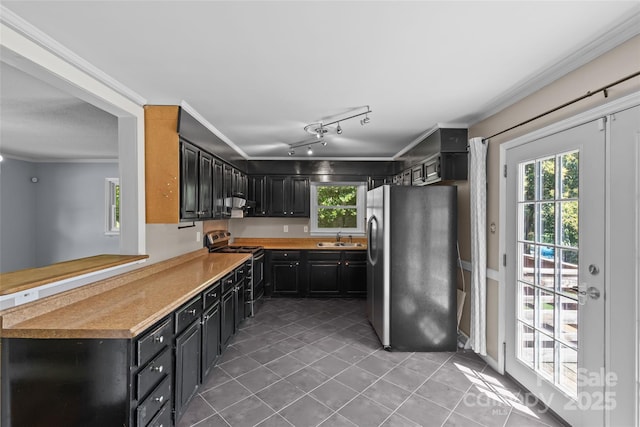 2000 Townsend Ave, Charlotte, NC 28205 - kitchen featuring freestanding refrigerator, range, light tile patterned floors, healthy amount of natural light, and ornamental molding