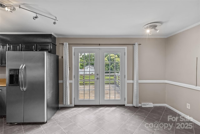 2000 Townsend Ave, Charlotte, NC 28205 - kitchen featuring stainless steel fridge, french doors, light tile patterned floors, crown molding, and dark cabinetry