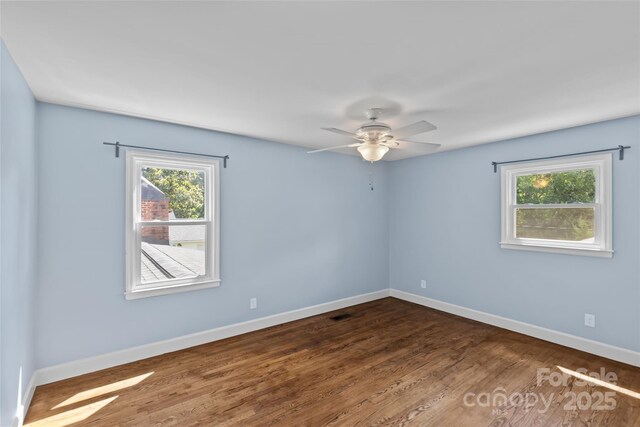 2000 Townsend Ave, Charlotte, NC 28205 - empty room featuring a ceiling fan and dark wood-style flooring