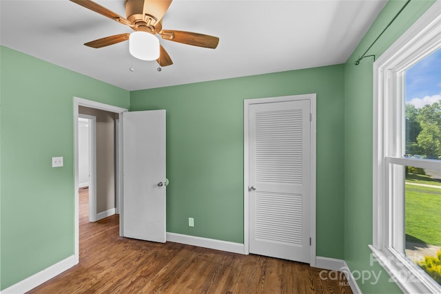 2000 Townsend Ave, Charlotte, NC 28205 - unfurnished bedroom with wood finished floors, a closet, and a ceiling fan
