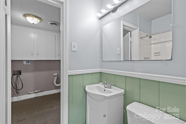 2000 Townsend Ave, Charlotte, NC 28205 - bathroom featuring vanity, wainscoting, a shower, a decorative wall, and concrete floors