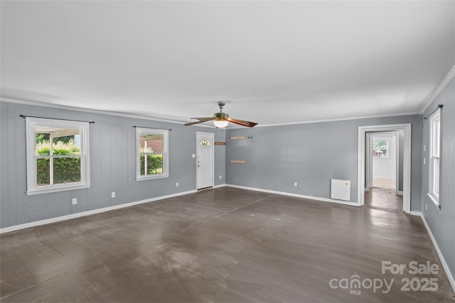 2000 Townsend Ave, Charlotte, NC 28205 - unfurnished living room featuring ornamental molding, ceiling fan, and finished concrete floors