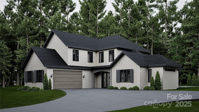 10220 Idlewild Rd, Matthews, NC 28105 - modern farmhouse style home featuring a front yard, driveway, a garage, and view of wooded area