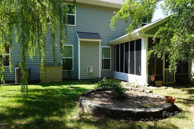 4003 Northerly Island Ct, Gastonia, NC 28056 - rear view of house with a sunroom and a lawn