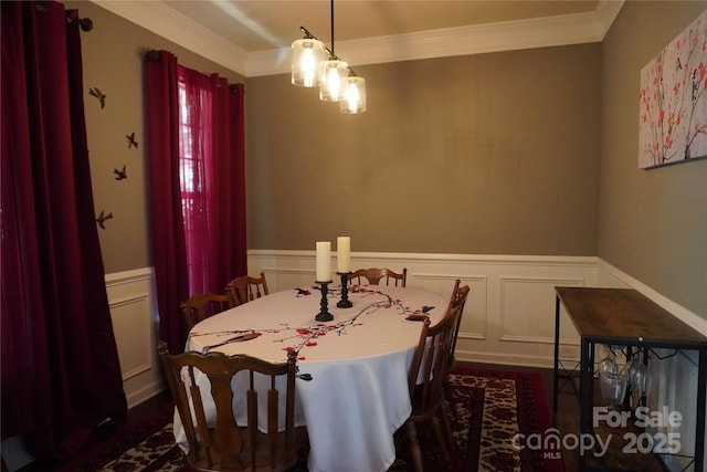 4003 Northerly Island Ct, Gastonia, NC 28056 - dining room featuring ornamental molding, wainscoting, dark wood-style floors, a decorative wall, and a chandelier