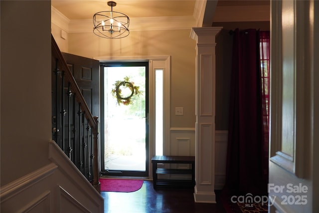 4003 Northerly Island Ct, Gastonia, NC 28056 - foyer with ornamental molding, a decorative wall, wainscoting, a chandelier, and dark wood-type flooring