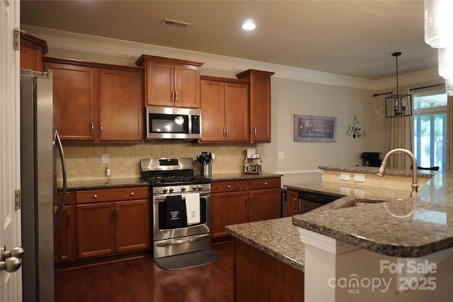 4003 Northerly Island Ct, Gastonia, NC 28056 - kitchen featuring appliances with stainless steel finishes, ornamental molding, backsplash, dark wood-type flooring, and dark stone counters