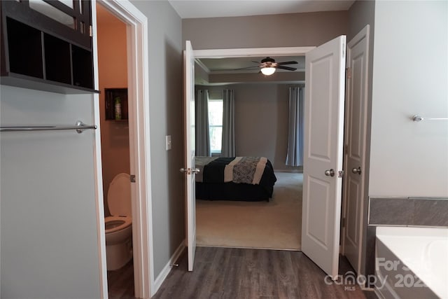 4003 Northerly Island Ct, Gastonia, NC 28056 - ensuite bathroom featuring wood finished floors, ceiling fan, and a tub to relax in