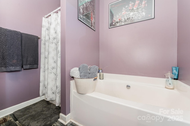 4242 Lake Ridge Ct, Ramseur, NC 27316 - full bath featuring a garden tub and baseboards