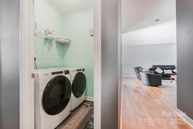 4242 Lake Ridge Ct, Ramseur, NC 27316 - laundry area featuring washer and dryer and wood finished floors