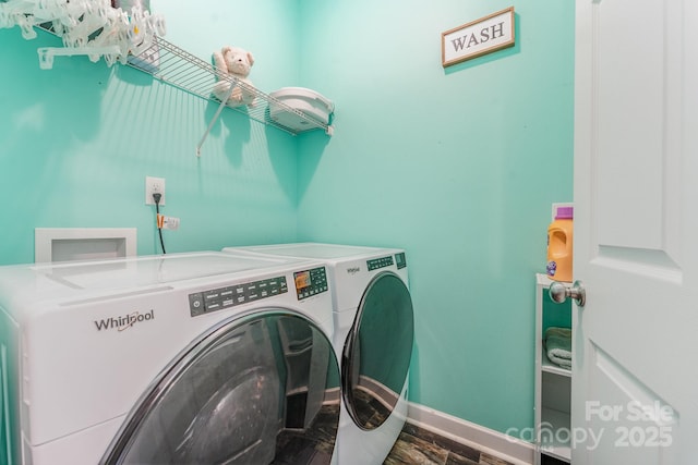 4242 Lake Ridge Ct, Ramseur, NC 27316 - washroom with washing machine and clothes dryer and wood finished floors