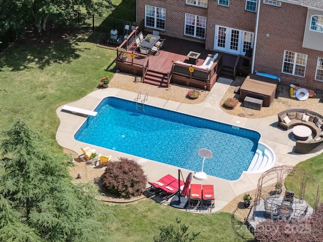 6523 Alba Rose Ln, Huntersville, NC 28078 - outdoor pool featuring an outdoor living space with a fire pit, a deck, outdoor dining space, and a diving board