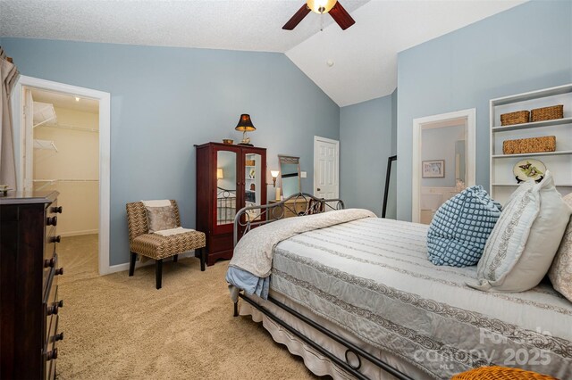 13416 Kintyre Ct, Matthews, NC 28105 - bedroom with lofted ceiling, light carpet, a spacious closet, a closet, and a ceiling fan