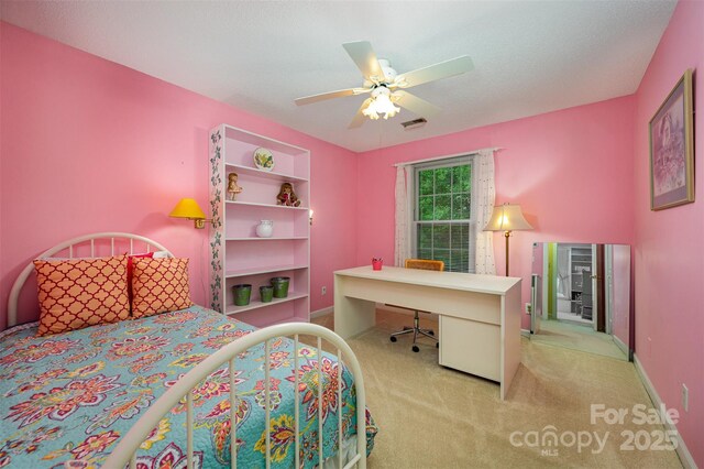 13416 Kintyre Ct, Matthews, NC 28105 - carpeted bedroom with an office area and a ceiling fan